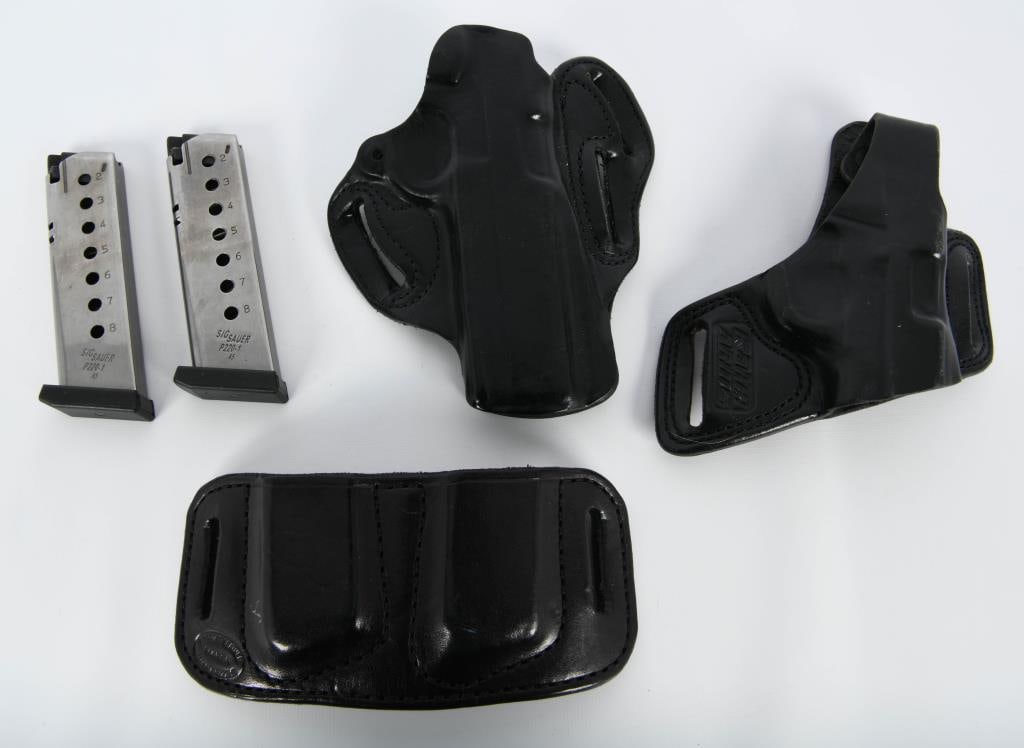 2 Sig Sauer P220-1 .45 Cal Mags & Holsters: ,Hello, firearm enthusiasts! Dive into this comprehensive lot featuring 2 Sig Sauer P220-1 .45 caliber magazines, accompanied by a pair of black leather right-handed holsters and a convenient magazine