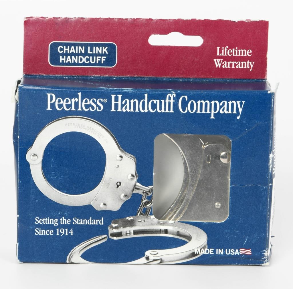 Peerless Handcuff Model 700 w/Key: Lot contains one set of chain link Peerless Handcuff Model 700 with one key, standard nickel handcuffs in the box. Peerless Handcuff Company was established in 1914 in Springfield, Massachusetts. Now,