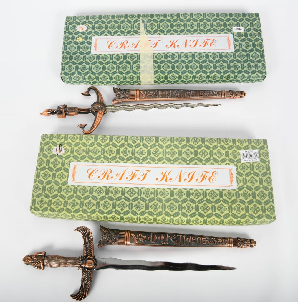 2 New in the Box Craft Knife Fantasy Daggers: Attention, enthusiasts! We present 2 brand-new in the box Craft Knife Fantasy Daggers, each boasting a striking bronze color finish. With impressive dimensions of approximately 13 1/2" long overall an