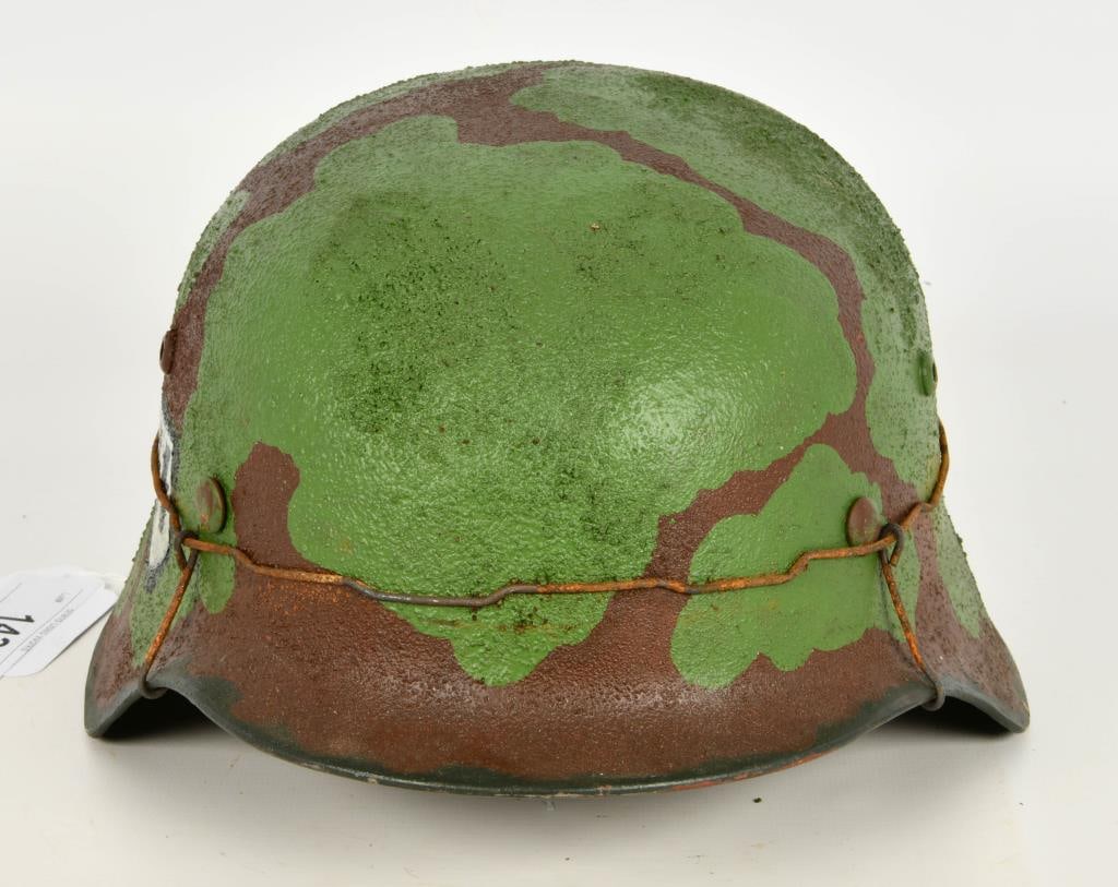 German WWII SS M40 Waffen Helmet Normandy: German WWII SS M40 Waffen Helmet - Normandy, this helmet appears to be replica of the original WWII M40 German Helmet, comes with the Green and Brown Textured camo print with the wire and SS decal on 