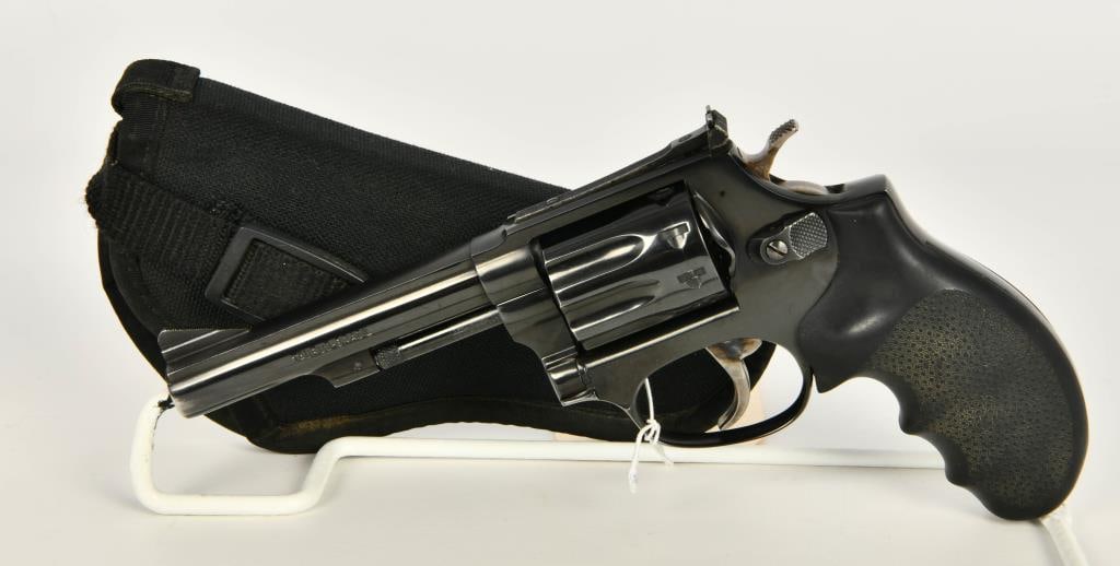 Taurus Model 94 Revolver 9 Shot .22 LR: Up Next We Have a Taurus Model 94, which looks very much like a S&W Model 63 "Kit Gun". This 9-shot revolver is fitted with a 4" barrel, adjustable rear sight, Rubber Grips, Constructed of Stainless S