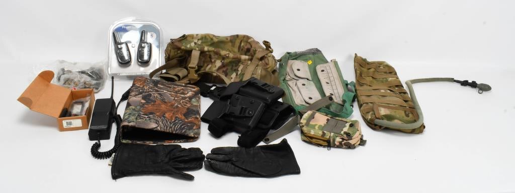 Box Lot of Various Auction Goodies: We are thrilled to offer a box lot of various auction goodies. This exciting assortment includes a new Ruger gun lock, a camo tactical water bag, a pair of leather gloves, a leg strap duty holster, wa