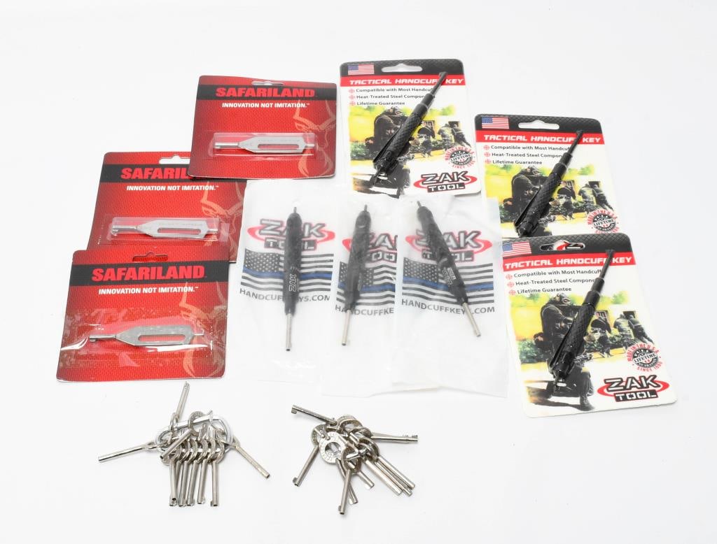 29 Various Style Handcuff Keys: We are excited to present a collection of 29 various style handcuff keys. This assortment includes 6 Zak Tool keys, 3 Safariland keys new in box, and 21 Peerless keys. Perfect for collectors, law enfo