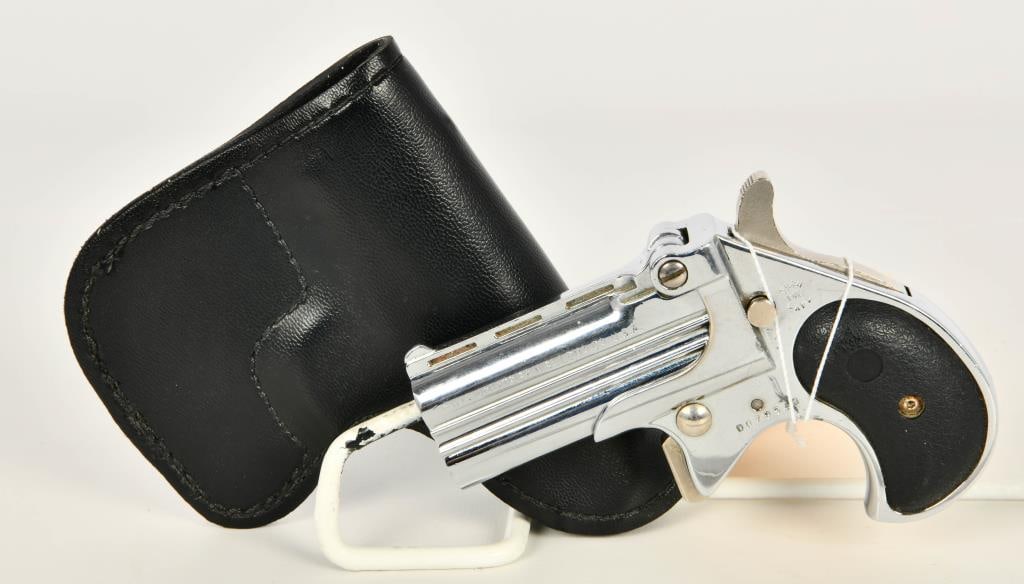Davis Industries DB-22 Magnum Derringer Pistol: Here is your pocket rocket, This Davis DB-22 Two Shot derringer is chambered in .22 Magnum, Plastic grips, Chrome Finish, Bell Leather Holster, and Appears in Great Pre-owned Condition. Drop this in y