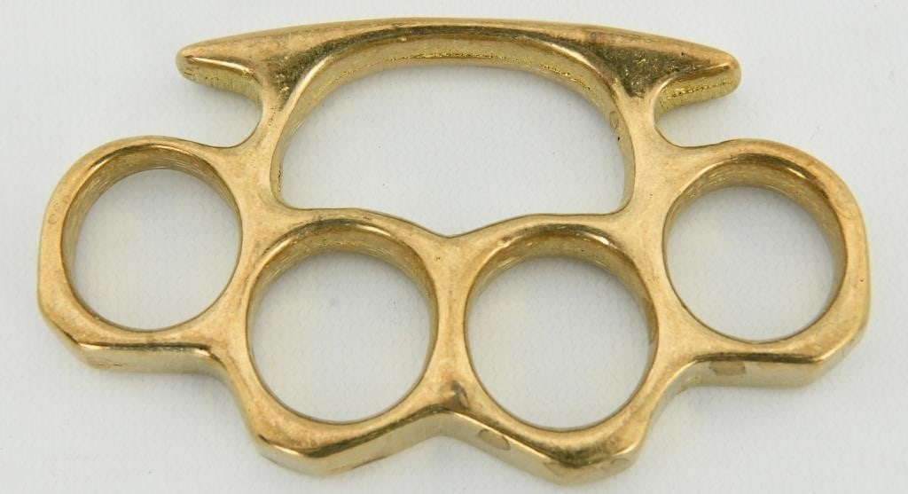 Vintage Real Brass Knuckles Knuckledusters: This listing is for antique/vintage brass knuckles. These are solid brass with an excellent aged patina. They measure 4-1/4" by 2-1/2" and are 3/8" wide. Please Note: These are being sold as a novelty
