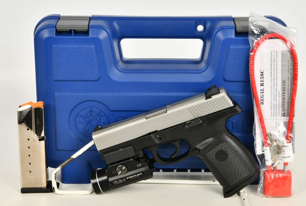 Smith & Wesson SW40VE Semi Auto Pistol .40 S&W: Introducing the Smith & Wesson SW40VE Semi Auto Pistol chambered in .40 S&W, equipped with a Streamlight TLR 1 Flashlight. This firearm also comes with two magazines, a lock, and is housed in a hard c