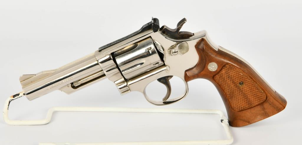 Nickel Smith & Wesson Model 19-4 Revolver .357 Mag: Smith & Wesson Model 19-4 Revolver - Elegance in Every Detail, .357 Magnum Marvel at the sheer opulence of the Smith & Wesson Model 19-4 Revolver, a true masterpiece in both form and function. Drenche