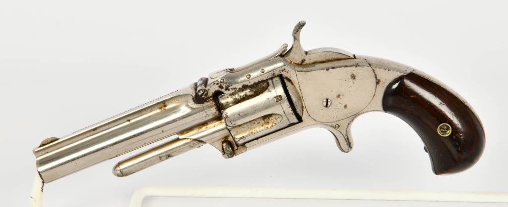 Smith & Wesson Top Break Model 1 1/2 .32 RF: Up Next We Have a Smith & Wesson Top Break Model 1 1/2 Revolver Second Issue, Chambered in .32 caliber rimfire, 3 1/2" Barrel, Half Moon Front Blade Sight, Notched rear sight, Original Wood Grips Seri