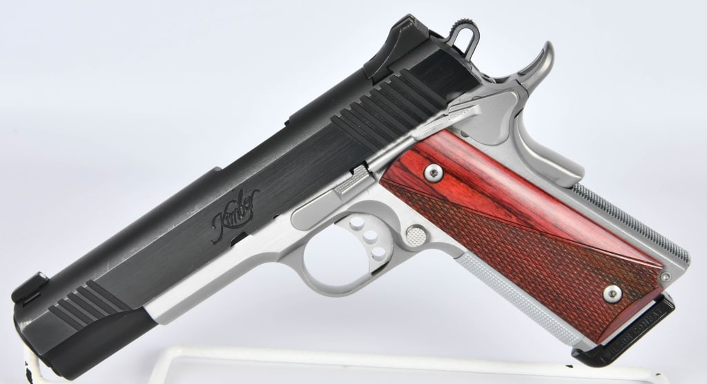 Kimber Custom II Semi Auto Pistol .45 ACP: Up Next We Have a Kimber Custom II Semi Auto Pistol Chambered in .45 ACP, and Comes Dressed in Checkered Grips, and Also Comes With One Magazine, In Duotone, Overall Appears in Excellent Like New Cond