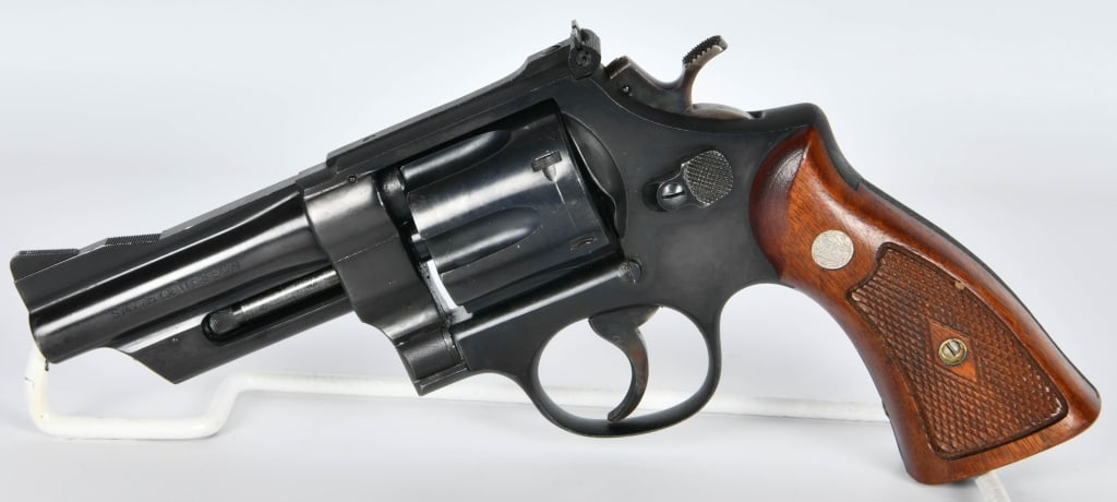 Smith & Wesson Model 28-2 Highway Patrolman .357: Here is a Smith & Wesson Model 28-2 Highway Patrolman Chambered in .357 Magnum, Serial #S301786, Checkered Wood Grips, Case Color Serrated Trigger & Hammer, 4" Pinned Barrel, Recessed, Ramped Front Si