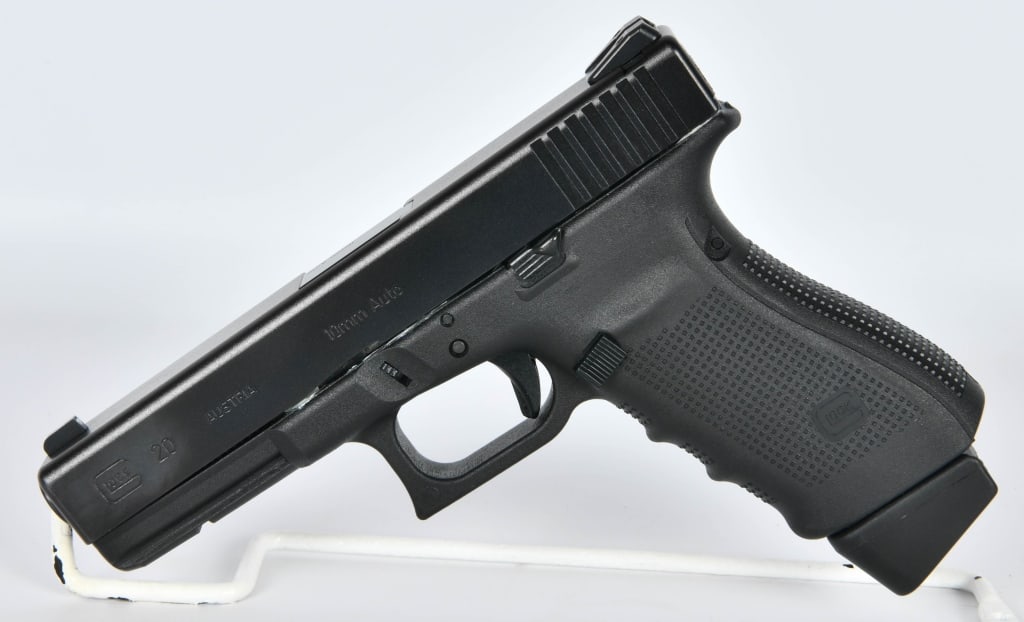 Glock 20 Gen4 Semi Auto Pistol 10MM: Up Next We Have a Glock 20 Gen3 Semi Auto Pistol Chambered in 10MM, It Comes With One 15 Round Magazine With a +2, Trijicon Sights, and Appears in Excellent Condition.