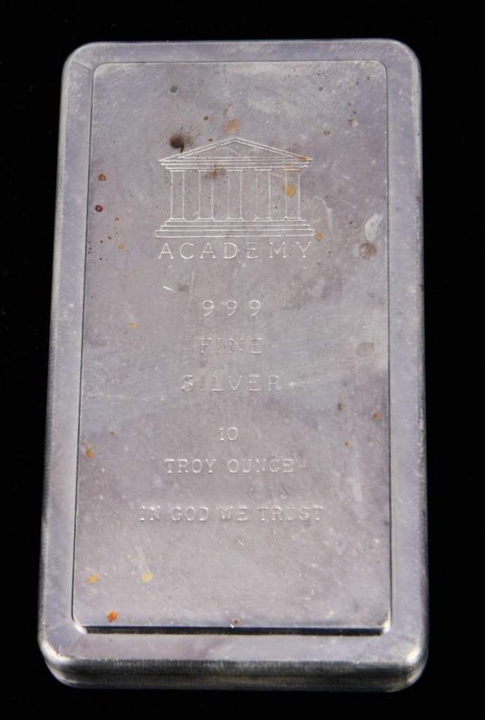 10 oz Academy Silver Bar Small Font Stacker: Design .999; The 10 oz Academy Silver Bar featuring the Small Font Stacker Design is a distinguished piece of bullion that holds both aesthetic appeal and intrinsic value. Crafted from .999 fine silve