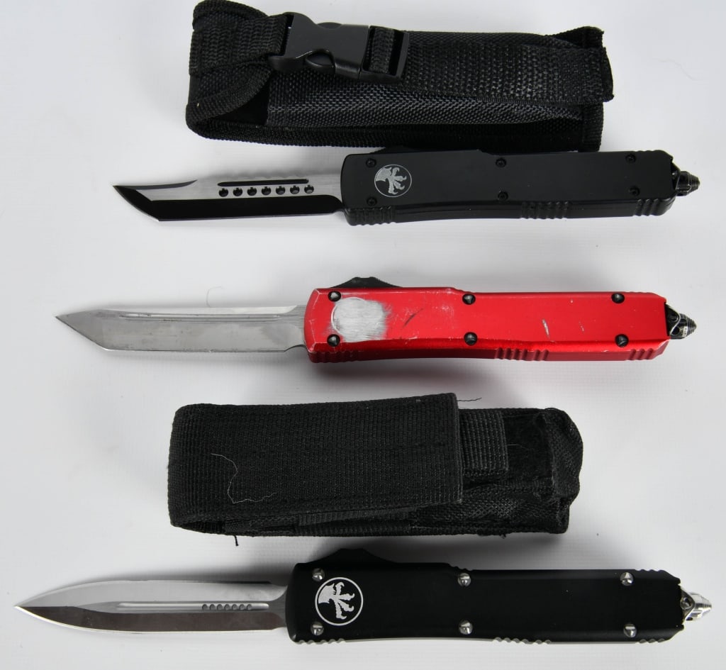 (3) Microtech clones OTF Tactical knives: lof contains two Microtech clones OTF tactical survival knives with the nylon sheath, and one Red OTF tactical pocket knives no sheath.