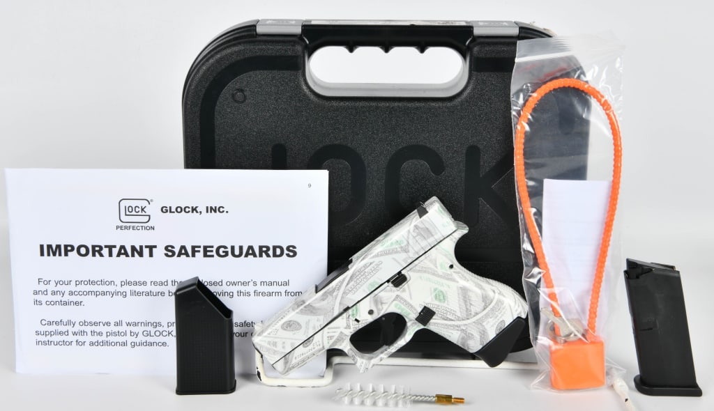 Money Glock 43 Semi Auto Pistol 9MM: Up Next We Have a Money Glock 43 Semi Auto Pistol Chambered in 9MM, This Pistol is Wrapped in Hundred Dollar Bills! Cool Cerakote. It Appears as Brand New and Comes With Two Magazines, Lock, Paperwork