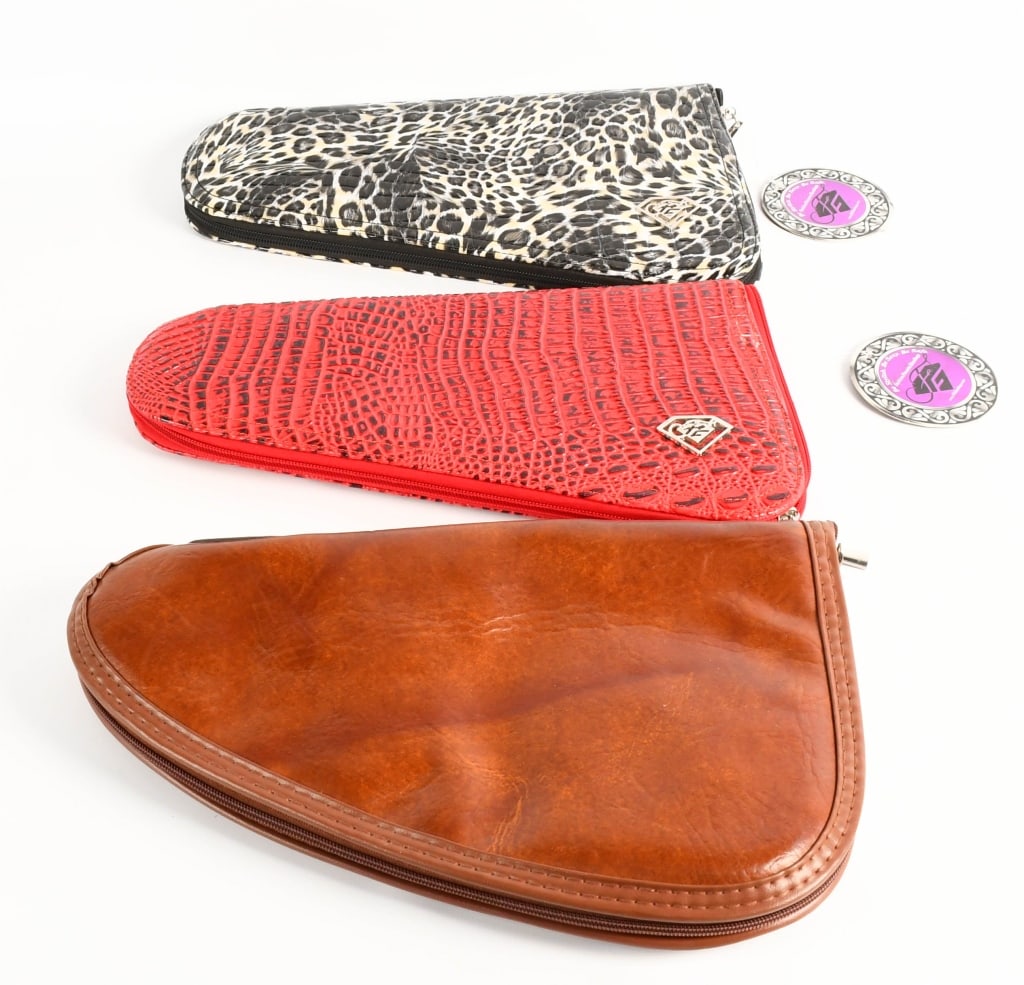 (3) Handgun Case 2 from Fashion Firearm Handbags: one case is a faux leather soft case with faux sheepskin liner for a Smith and Wesson 10 7 .38 spl in real nice pre owned condition and measures approx 12.5x7.5" then we have a New with tag Red pistol