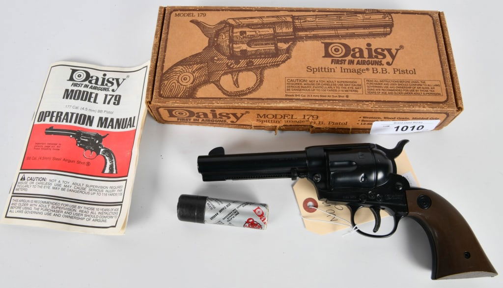 Daisy Model 179 Revolver BB Gun W/ Box: Spitting Image Western Design Wood Grain Molded Handles, Comes In the Original Box With Manual & BBs , Appears in Overall Excellent Condition