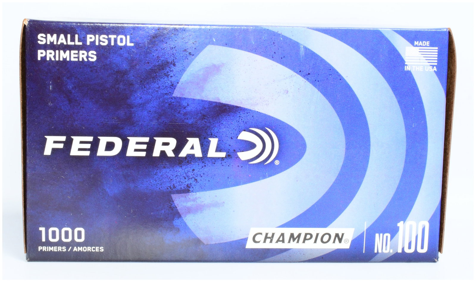 Federal Champion No. 100 Small Pistol Primers, 1000 Count: A box of Federal Champion No. 100 Small Pistol Primers. This item consists of a rectangular cardboard box containing 1000 primers. The packaging is modern, predominantly dark blue with white and light