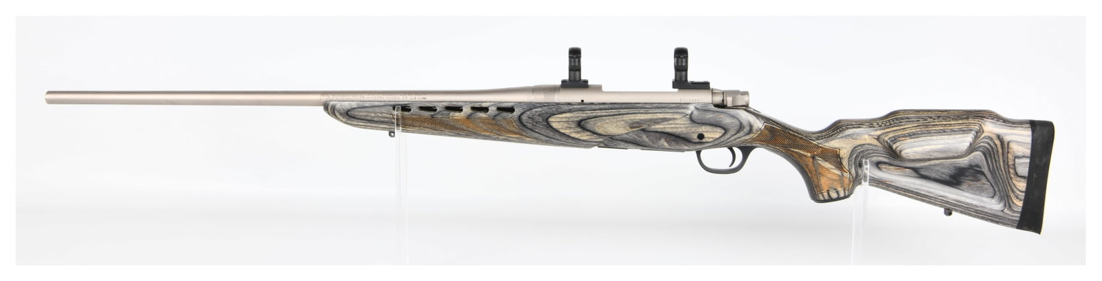 Mossberg 4x4 Ducks Unlimited .300 Win Mag Bolt Action Rifle: A Mossberg 4x4 Ducks Unlimited .300 Win Mag Bolt Action Rifle, manufactured in North Haven, CT, U.S.A. This modern rifle features a distinctive laminated wood stock with grey and tan swirling patterns