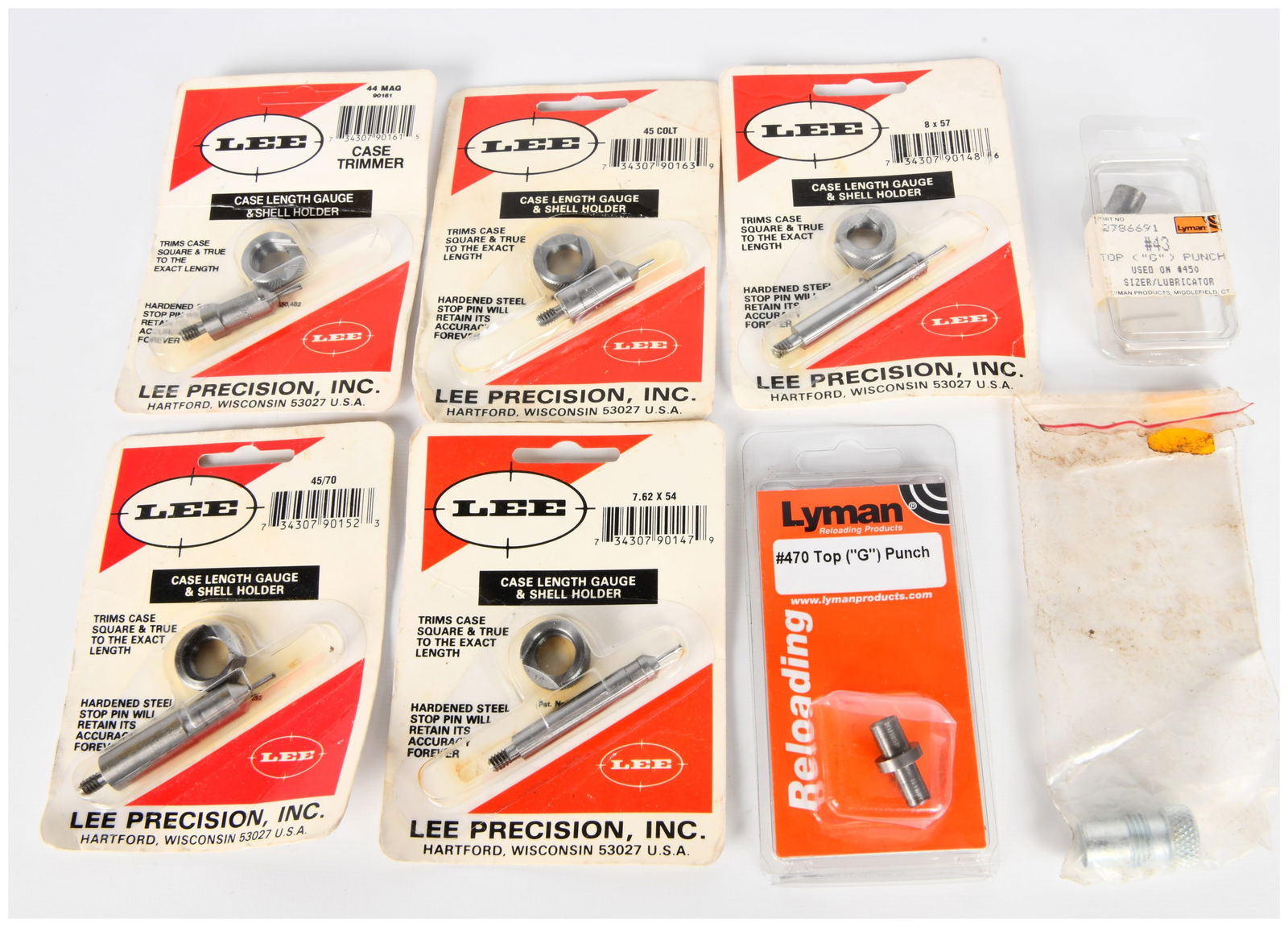A Group of Modern Firearm Reloading Tools by Lee Precision and Lyman: A group of modern firearm reloading tools, primarily comprising multiple "CASE LENGTH GAUGE & SHELL HOLDER" sets by Lee Precision, Inc. These sets are still sealed in their original cardboard and clea