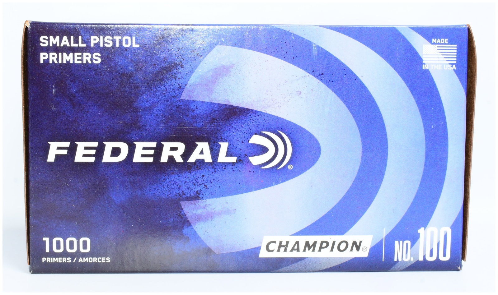 Federal Champion Small Pistol Primers No. 100, 1000 Count: A box of Federal Champion Small Pistol Primers No. 100. This item consists of a rectangular, dark blue cardboard box with light blue and white graphics. The box is clearly marked "FEDERAL" with its ac