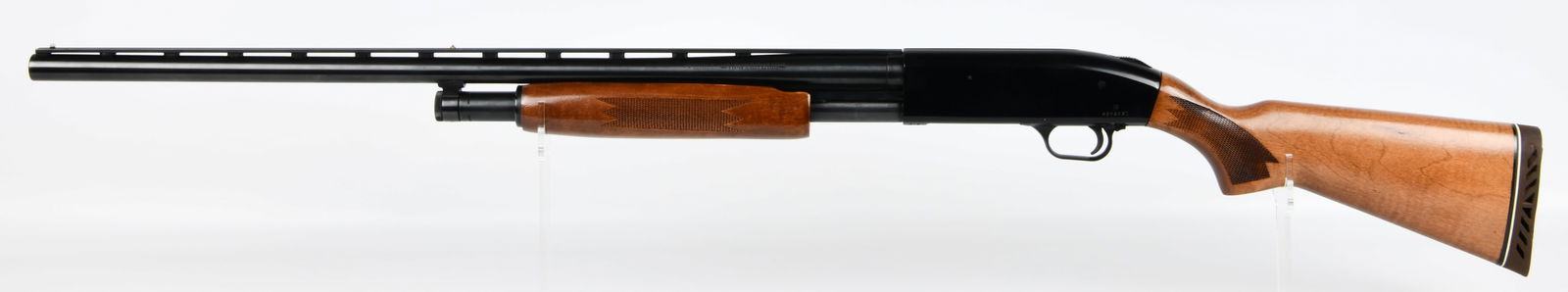 Mossberg 500A 12 Gauge Pump-Action Shotgun with 28-Inch Ventilated Rib Barrel: A Mossberg 500A 12 gauge pump-action shotgun. The firearm is chambered for 2? and 3-inch shells and features a 28-inch barrel with a ventilated rib and a modified choke. It is constructed from blued m