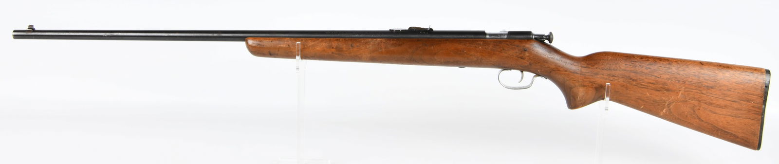 Winchester Model 67A .22 S, L, LR Bolt-Action Rifle: A Winchester Model 67A bolt-action, single-shot rifle, chambered for .22 Short, Long, or Long Rifle ammunition. The rifle features a dark blued steel barrel and receiver, paired with a light to medium