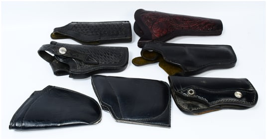 A Collection of Vintage Leather Police and Military Revolver Holsters, including Bucheimer and USAF