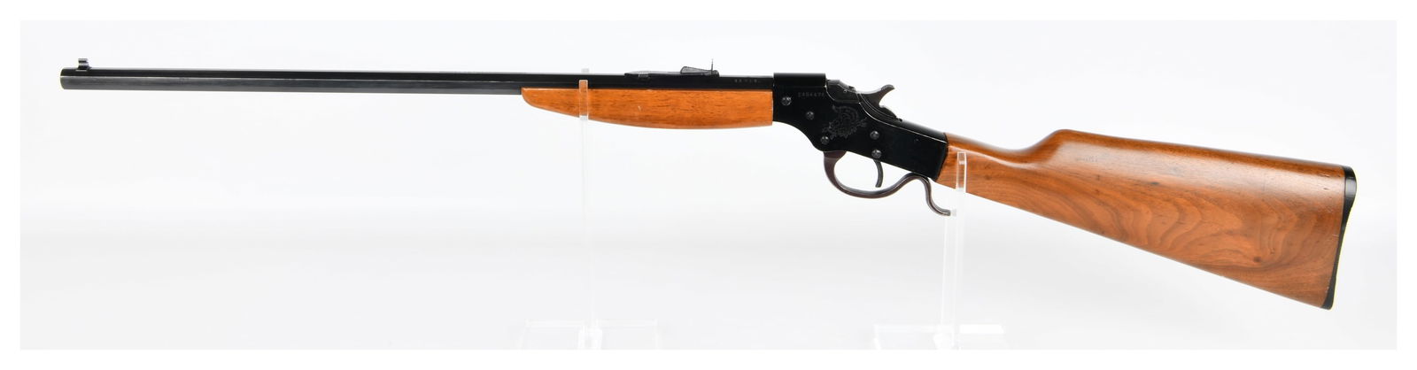 Savage Model 72 Single Shot Rifle, .22 S-L-LR & .22 MAG.: A Savage Model 72 Single Shot Rifle, featuring a blued steel octagonal barrel and receiver, paired with a light-colored wooden stock and forend. The rifle presents with an exposed hammer and a lever-a