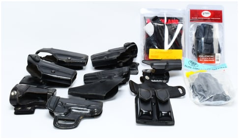 A Collection of Modern Firearm Holsters and Magazine Pouch, including Safariland, FOBUS, and Bianchi