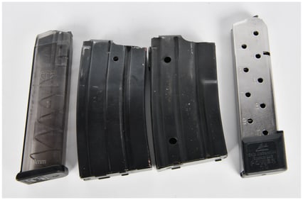 A Group of Four Assorted Firearm Magazines, including Glock 19, AR-15/M16, and Chip McCormick .45
