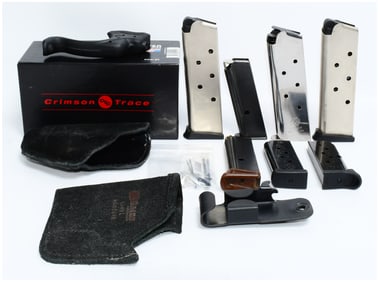 A Collection of Modern Firearm Accessories, including a Crimson Trace LG-412H Laser Grip, Magazines,