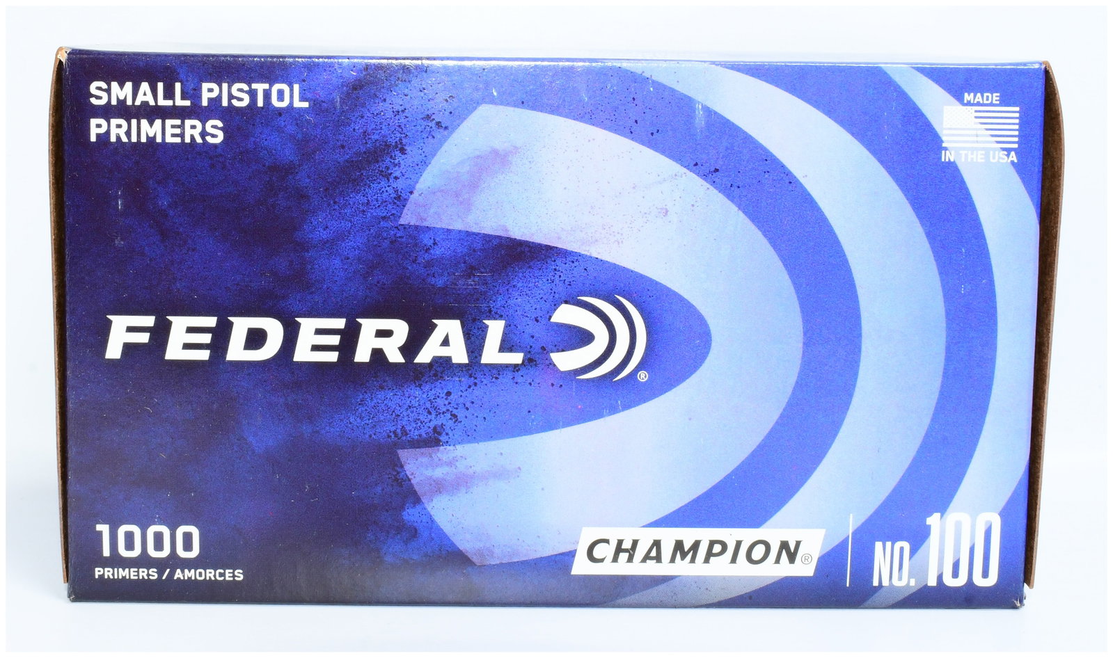 Federal Champion No. 100 Small Pistol Primers, 1000 Count: A box of Federal Champion No. 100 Small Pistol Primers, 1000 count. The rectangular cardboard box features a modern design with a blue background, displaying prominent white text including "FEDERAL," 