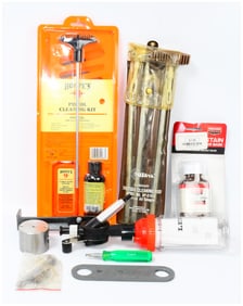A Collection of Hoppe's Pistol Cleaning Kit, Outers Shotgun Rod, and Reloading Supplies
