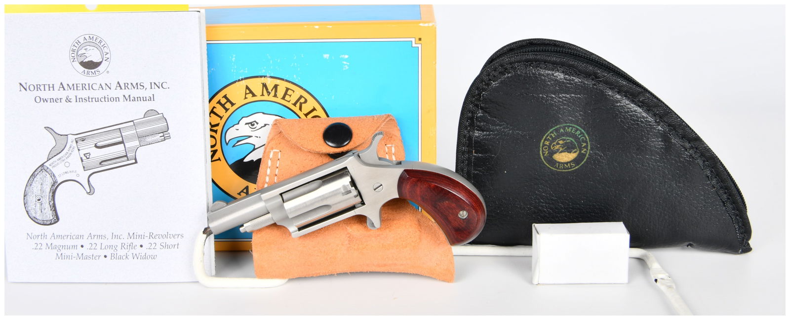 North American Arms NAA-22M Mini Revolver, .22 Magnum, with Accessories: A North American Arms, Inc. NAA-22M Mini Revolver, chambered in .22 Magnum. The firearm features a 1 5/8-inch barrel and is finished in brushed stainless steel. It is fitted with polished reddish-brow