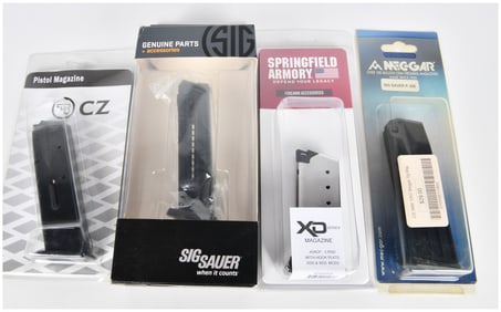 A Group of Four New Pistol Magazines by CZ, Sig Sauer, Springfield Armory, and Mec-Gar
