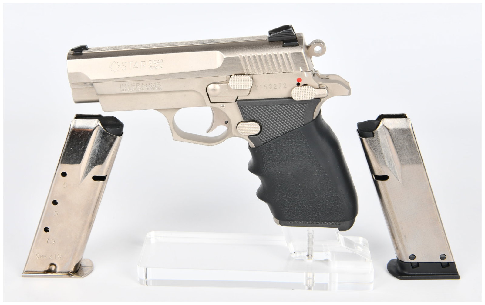 Interarms Star Firestar Plus 9mm Semi-Automatic Pistol with Two Magazines: A Star Interarms Firestar Plus 9mm semi-automatic pistol. This modern firearm features a brushed stainless steel or nickel-plated finish on the slide and frame, complemented by a black ergonomic rubbe
