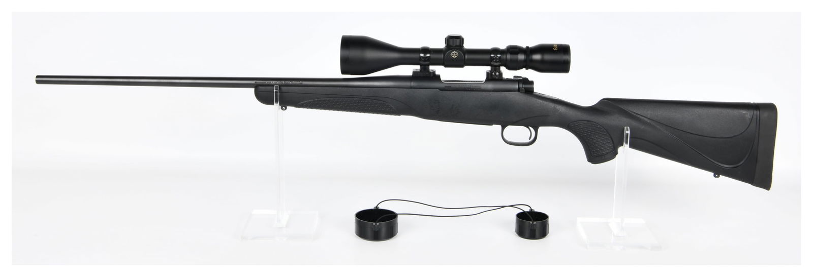 Winchester Model 70 Bolt Action Rifle .223 WSSM: A Winchester Model 70 bolt-action rifle chambered in .223 WSSM, serial number G2516248. The rifle features a black synthetic stock and a matte black finish on its metal components. Markings on the rif