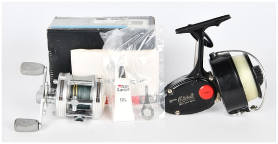 A Garcia Mitchell 302 Saltwater Spinning Reel and an Abu Garcia Ambassadeur 5500C3 Baitcasting Reel