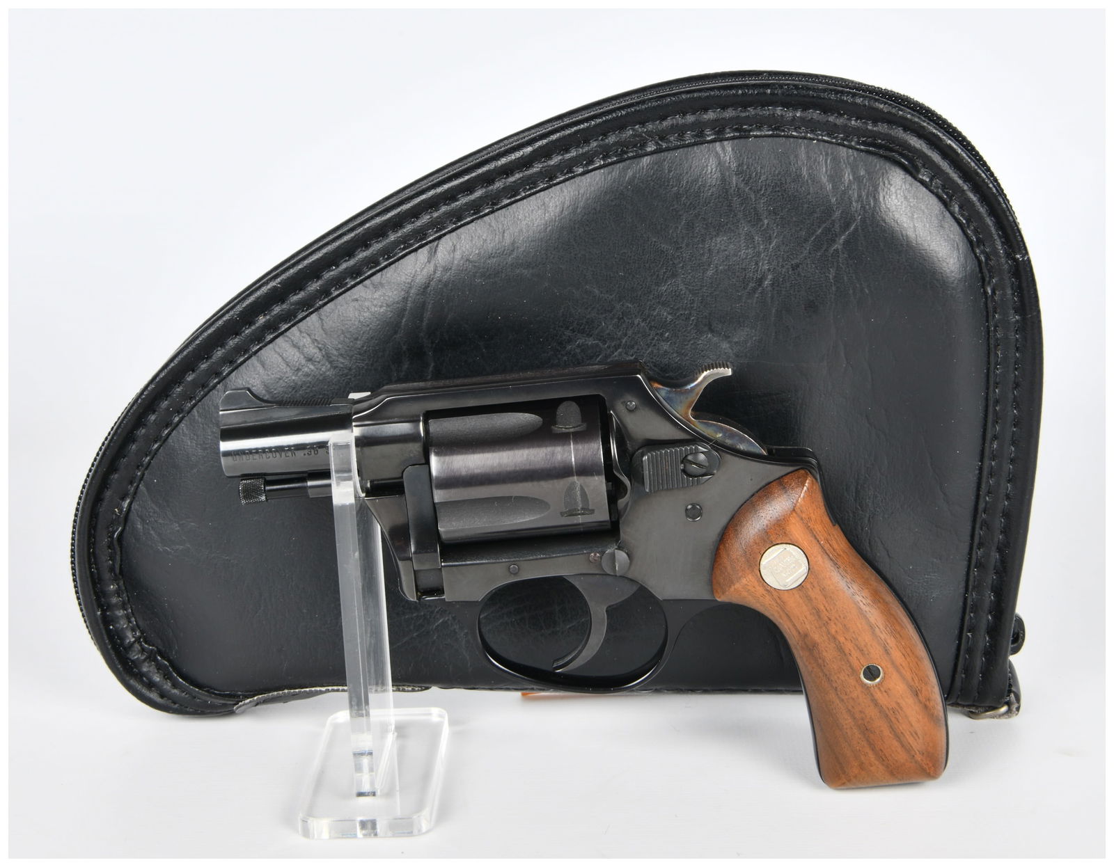 Charter Arms Undercover .38 Special Double Action Revolver: A Charter Arms Undercover .38 Special Double Action Revolver. This compact, modern-style revolver is constructed from blued metal with two-piece wooden grip panels. The left side of the barrel is mark