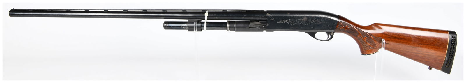 Remington Model 1100 Semi-Automatic 12 Gauge Magnum Shotgun, MISSING FOREGRIP: A Remington Model 1100 semi-automatic 12 Gauge Magnum shotgun, chambered for 3-inch shells with a FULL choke. The blued steel barrel and ornately scroll-engraved receiver are marked Remington Model 11