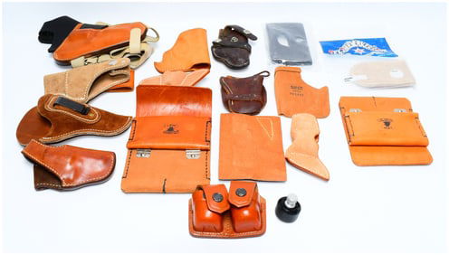 A Collection of Leather Firearm Holsters and Accessories