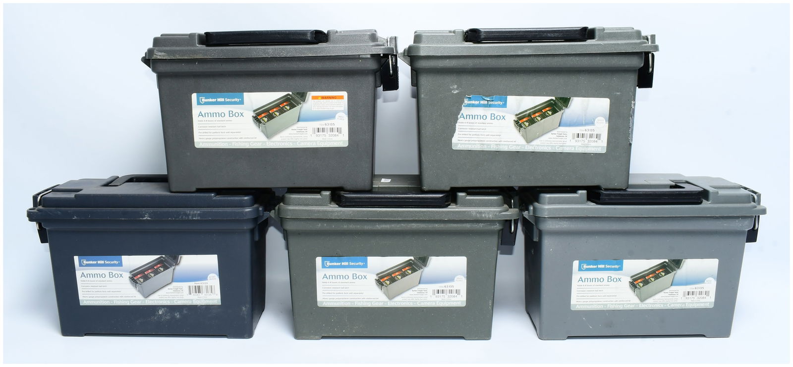 Four Bunker Hill Security Ammo Boxes, Model ITEM 63135: Four contemporary, utilitarian plastic storage boxes, identified as Bunker Hill Security Ammo Boxes, Model ITEM 63135. These boxes are constructed from heavy-gauge polypropylene with reinforced hinged