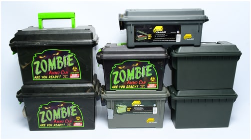 A Collection of Seven Plano and MTM Plastic Storage Containers, including 'Zombie Ammo Cans,' Shot