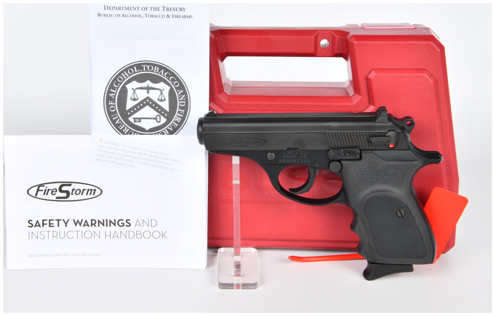 Bersa FireStorm Mate .380 ACP Semi-Automatic Pistol with Case and Documentation: A Bersa FireStorm Mate .380 ACP semi-automatic pistol, featuring a black metal frame and slide, and black molded polymer grips. Visible markings include FireStorm logos on the slide and grip, serial n
