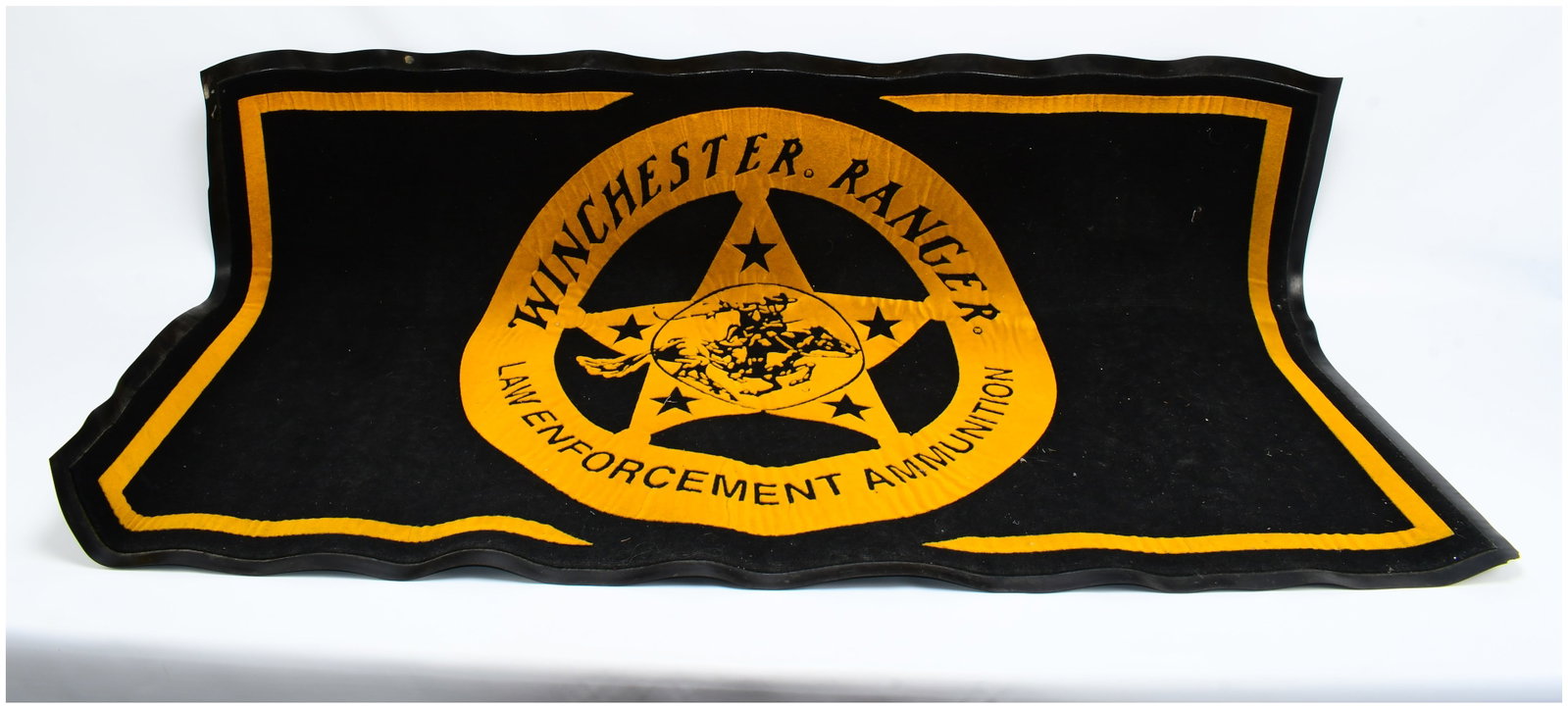 Winchester Ranger Law Enforcement Ammunition Promotional Mat, MEASURES 58 X 36: A black and golden-yellow promotional mat, likely a floor or door mat, featuring a Western-themed design. The central motif is a large five-point star, resembling a sheriff's badge, which encloses an 