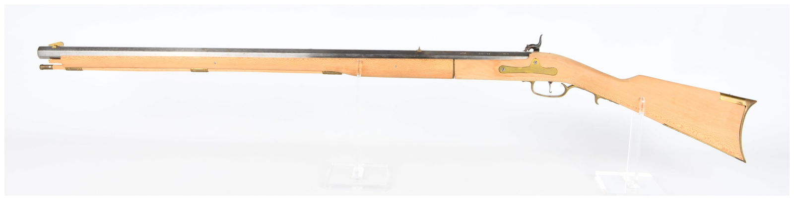 Spanish Jukar .45 Cal Black Powder Percussion Rifle, 19th-Century Style: A Spanish Jukar .45 Caliber Black Powder Percussion Rifle. This 19th-century style muzzleloading long gun features an octagonal steel barrel and a light-colored wooden full stock with distinctive figu