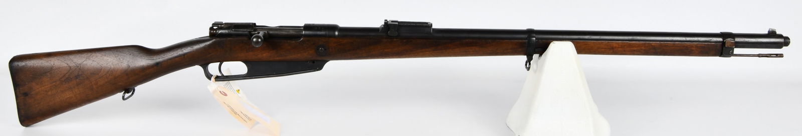 German Danzig Gewehr 1888 S Commission Rifle, Dated 1891: A German Danzig Gewehr 1888 S Commission Rifle, dated 1891. This bolt-action military rifle features a wooden stock and blued steel components. Visible markings on the receiver include a crown crest a