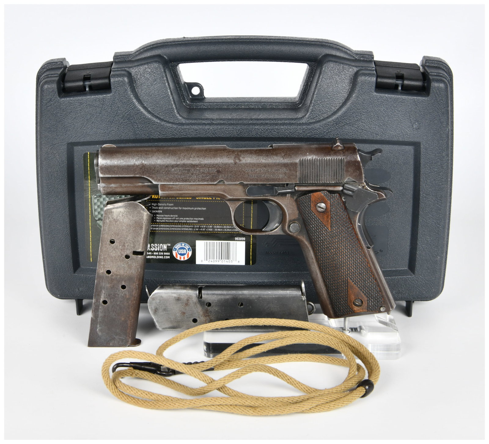 A WWI Era Colt Model 1911 U.S. Army Semi-Automatic Pistol, Serial Number N? 235607, with Two: A Colt Model 1911 U.S. Army Semi-Automatic Pistol, WWI Era, constructed of blued steel with checkered wooden grip panels. The pistol's left side is marked "MODEL OF 1911 U.S. ARMY" and bears the seria
