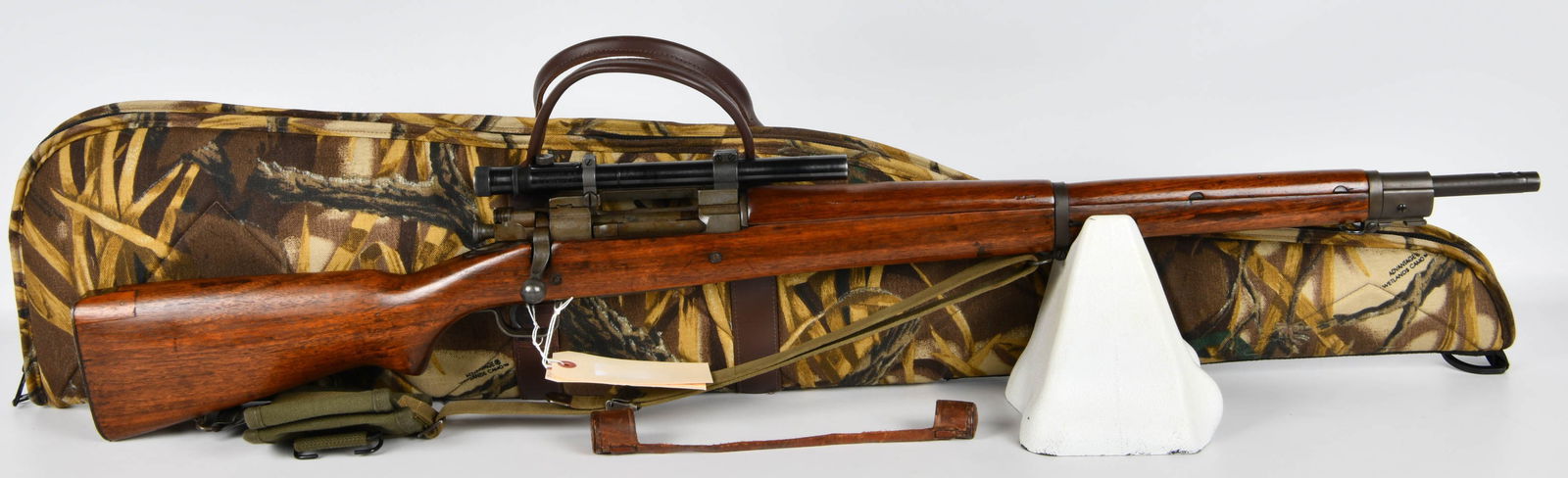 WWII U.S. Remington Model 1903A4 Sniper Rifle, .30-06, with W.R. Weaver Co. 330 Scope - M.8: A WWII U.S. Remington Model 1903A4 Sniper Rifle, chambered in .30-06 Springfield. The rifle features a classic wooden stock and blued or parkerized steel components. The receiver is marked "U.S. REMIN