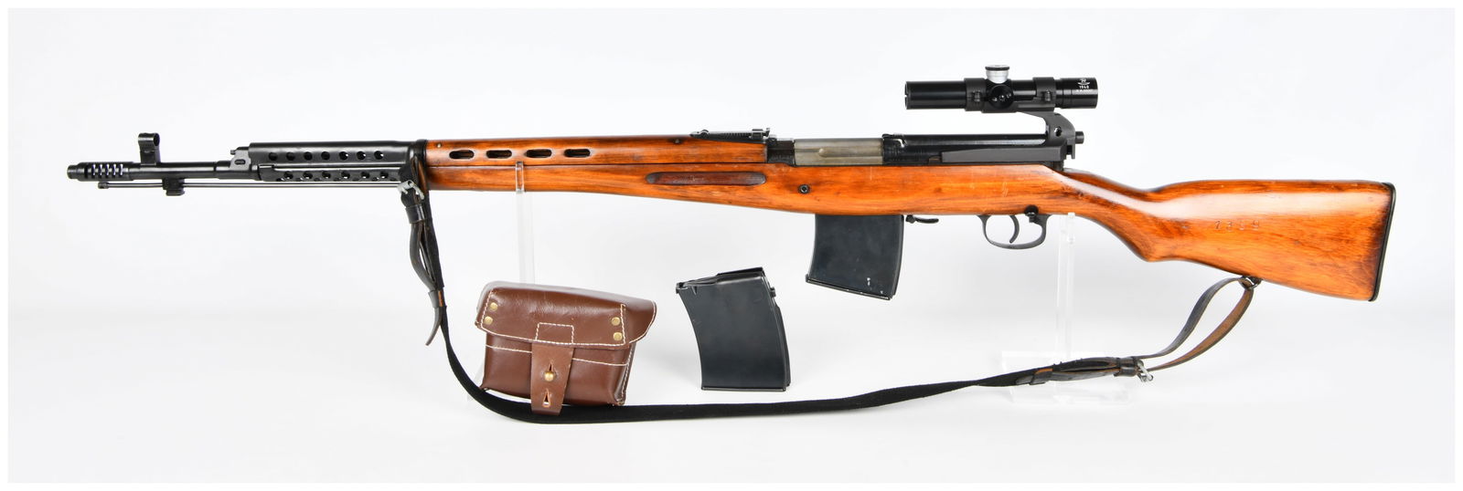WWII Soviet Russian Tula Arsenal SVT-40 Semi-Automatic Sniper Rifle with Scope, Dated 1940: A WWII Soviet Russian Tula Arsenal SVT-40 Semi-Automatic Sniper Rifle, also known as the Tokarev SVT-40, dated 1940. Chambered in 7.62 X 54R, the rifle features a light-colored wooden stock with a ven